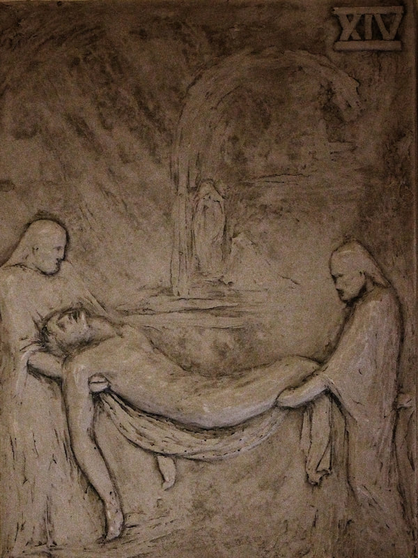 Fourteenth station: Jesus is laid in the tomb.